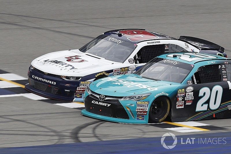 Denny Hamlin, Joe Gibbs Racing Toyota, William Byron, JR Motorsports Chevrolet, crosses the checkered flag