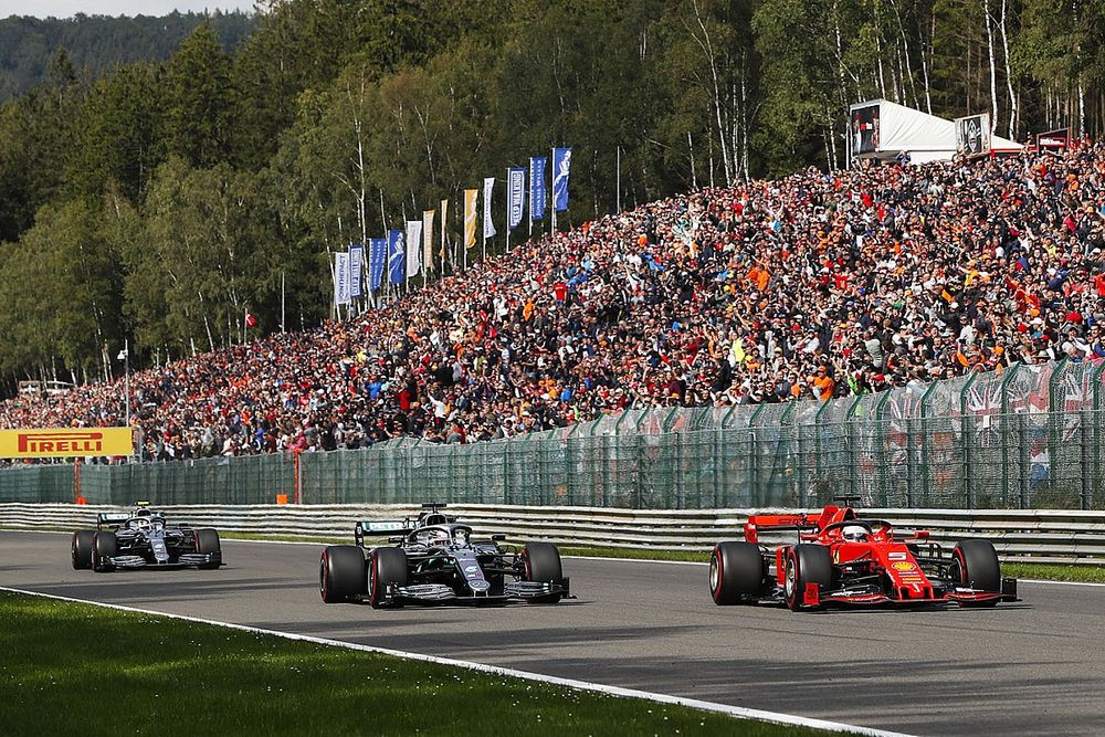 Sebastian Vettel, Ferrari SF90, leads Lewis Hamilton, Mercedes AMG F1 W10 and Valtteri Bottas, Mercedes AMG W10 