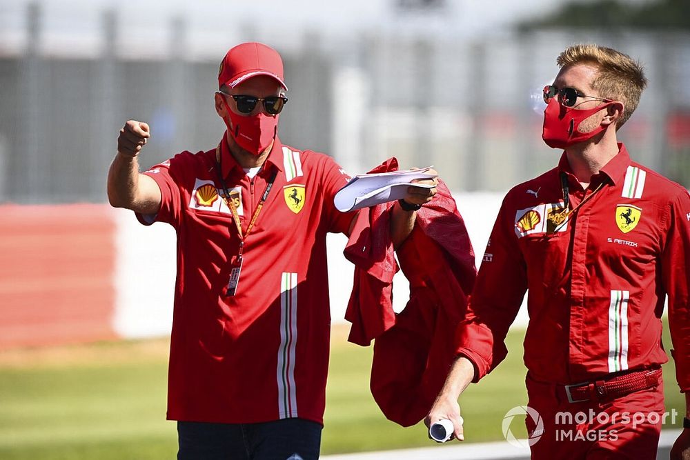 Sebastian Vettel, Ferrari walks the track with his engineers 