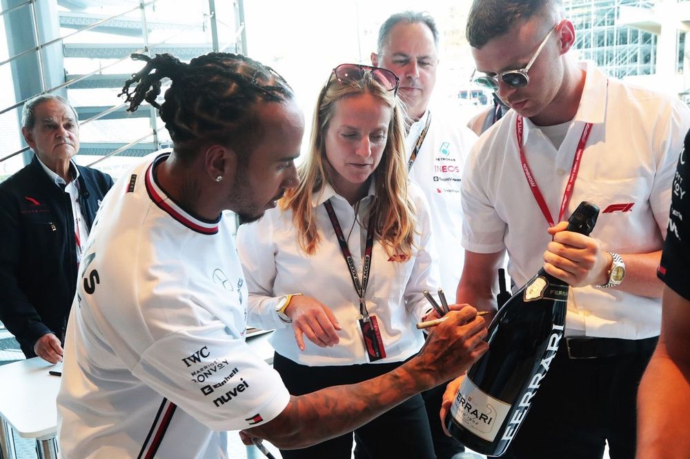 Lewis Hamilton, Mercedes signs Ferrari Champagne bottle for Charity