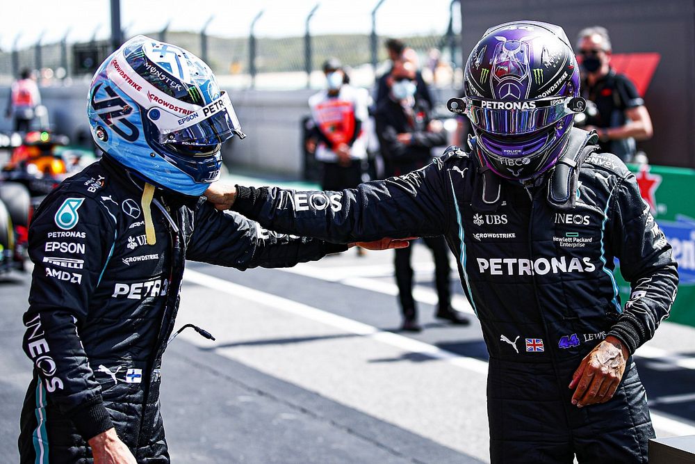 Pole man Valtteri Bottas, Mercedes, is congratulated by his team mate Lewis Hamilton, Mercedes, in Parc Ferme