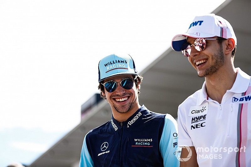 Lance Stroll, Williams Racing, with Esteban Ocon, Racing Point Force India