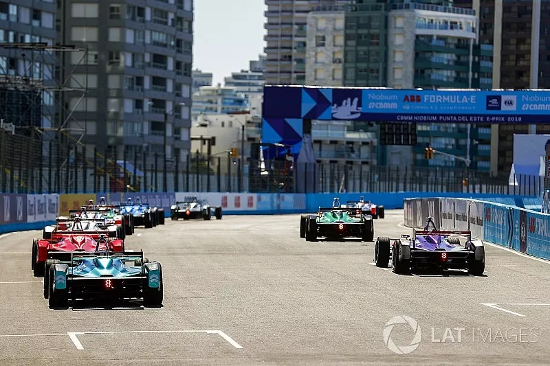 Drivers practice their starts on the grid