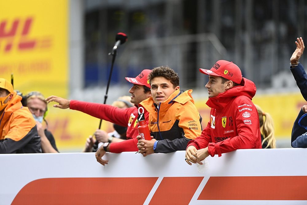 Carlos Sainz Jr., Ferrari, Lando Norris, McLaren, and Charles Leclerc, Ferrari, in the drivers parade