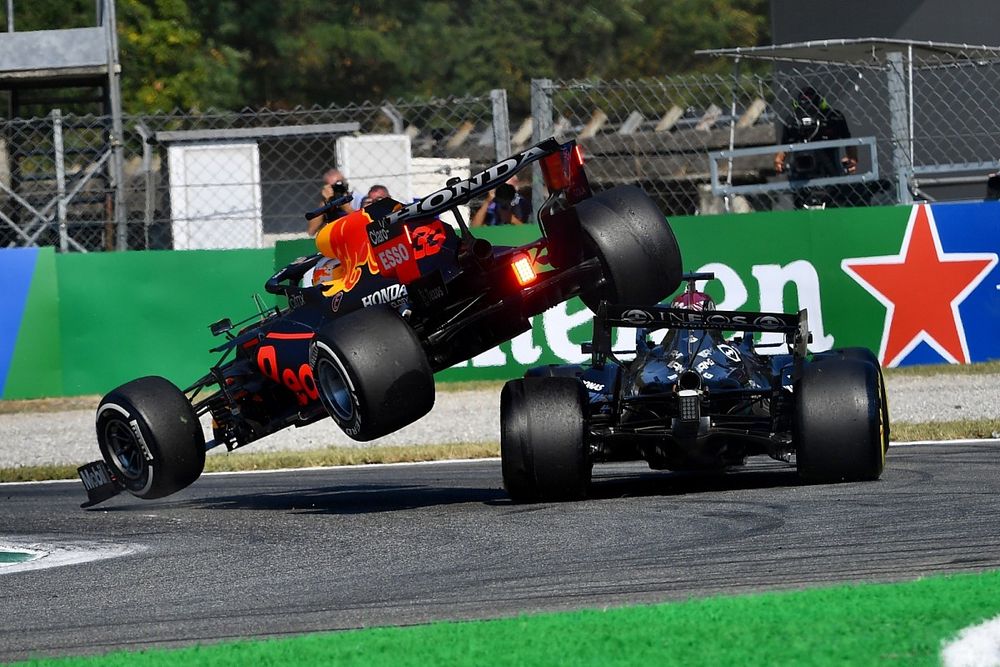 Max Verstappen, Red Bull Racing RB16B, and Lewis Hamilton, Mercedes W12, crash out