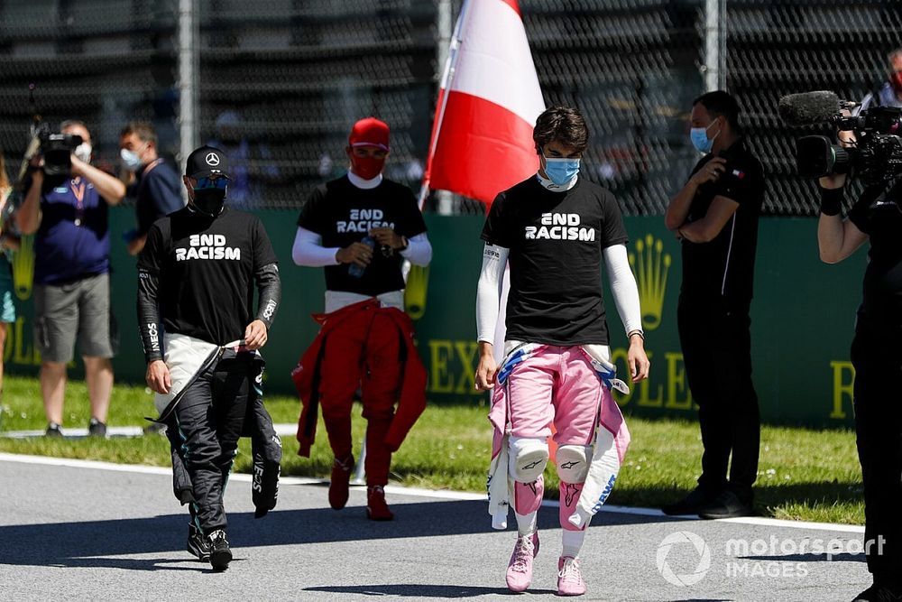 Valtteri Bottas, Mercedes-AMG Petronas F1, Charles Leclerc, Ferrari, and Lance Stroll, Racing Point, on the grid prior to the start