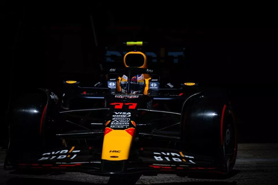 Sergio Perez, Red Bull Racing RB20, leaves the garage