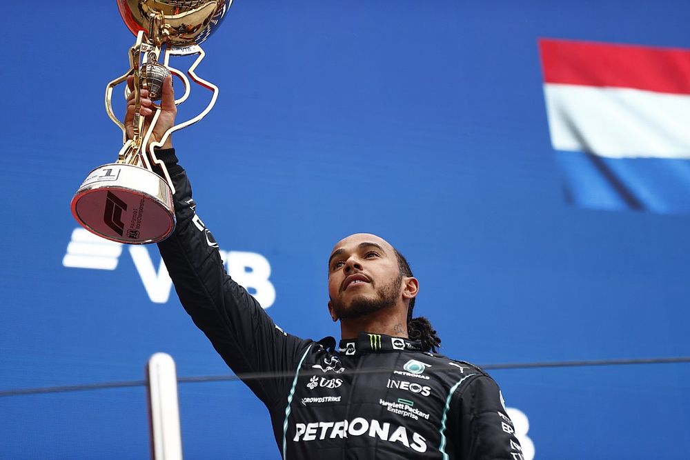 Lewis Hamilton, Mercedes, 1st position, lifts his trophy