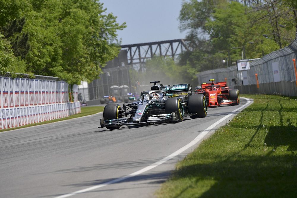 Lewis Hamilton, Mercedes AMG F1 W10, leads Charles Leclerc, Ferrari SF90