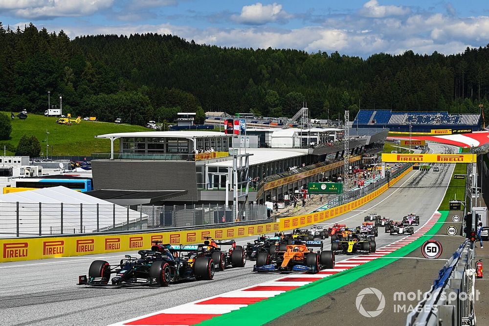 Lewis Hamilton, Mercedes F1 W11 EQ Performance, leads Max Verstappen, Red Bull Racing RB16, Carlos Sainz Jr., McLaren MCL35 Valtteri Bottas, Mercedes F1 W11 EQ Performance and the rest of the pack at the start