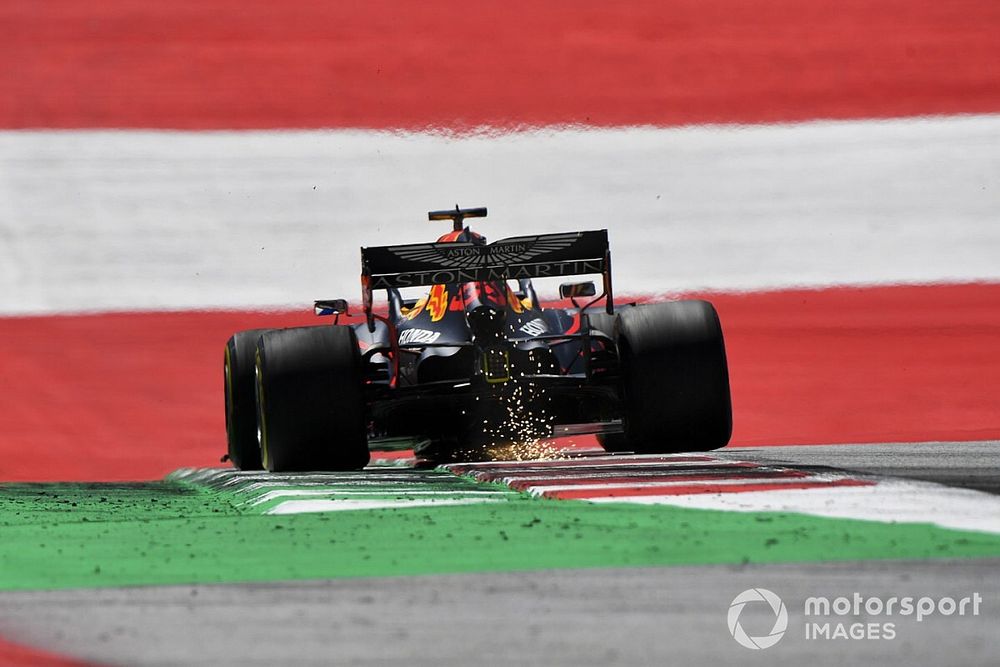 Sparks fly from the rear of Max Verstappen, Red Bull Racing RB16