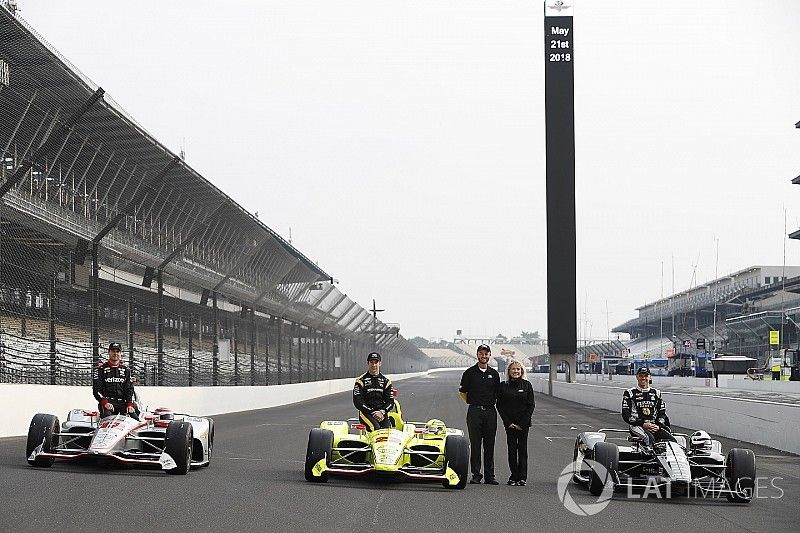 The front row of Will Power, Team Penske Chevrolet, Simon Pagenaud, Team Penske Chevrolet and Ed Carpenter, Ed Carpenter Racing Chevrolet with Rob Buckner and Judy Dominick