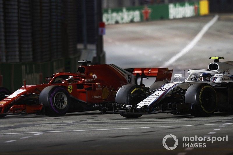 Sebastian Vettel, Ferrari SF71H, passes Sergey Sirotkin, Williams FW41