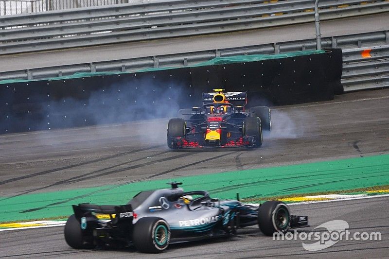 Lewis Hamilton, Mercedes AMG F1 W09, passes a spinning Max Verstappen, Red Bull Racing RB14 Tag Heuer, after the latter suffers a collision with Esteban Ocon, Force India VJM11 Mercedes. 