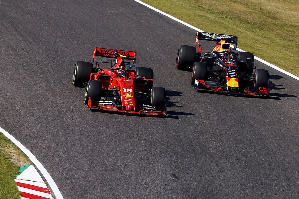 Charles Leclerc, Ferrari SF90, battles with Max Verstappen, Red Bull Racing RB15, on the opening lap