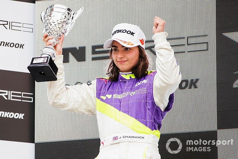 Jamie Chadwick celebrates on the podium