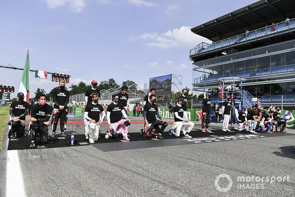 The drivers take to knees and stand in support of the End Racism campaign