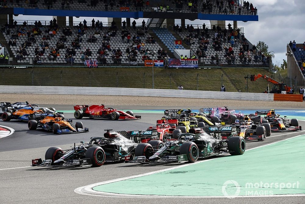 Valtteri Bottas, Mercedes F1 W11, and Lewis Hamilton, Mercedes F1 W11, lead the field away at the start