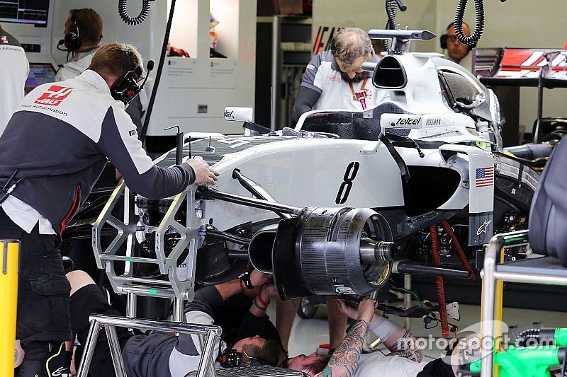 The Haas VF-16 of Romain Grosjean, Haas F1 Team is worked on in the second practice session