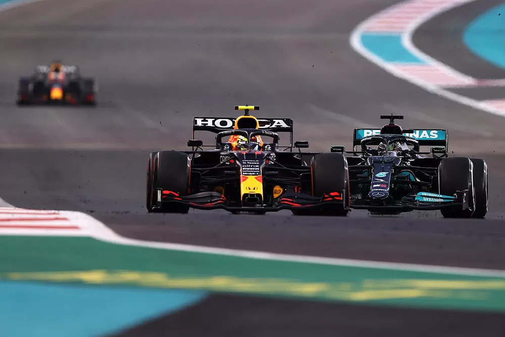 Sergio Perez, Red Bull Racing RB16B, Lewis Hamilton, Mercedes W12 battle for track position with Max Verstappen, Red Bull Racing RB16B
