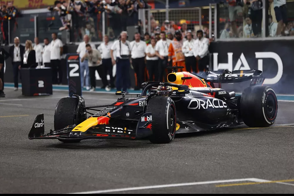 Max Verstappen, Red Bull Racing RB19, 1st position, performs donuts on the grid at the end of the race