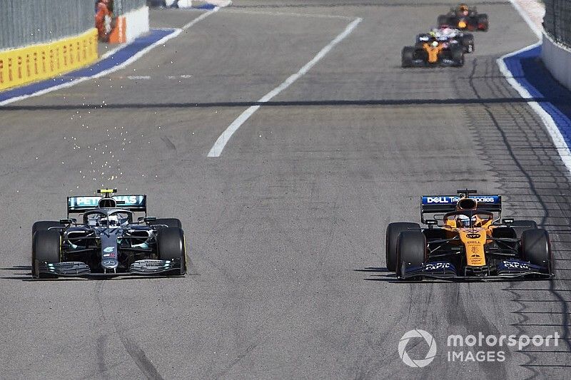 Valtteri Bottas, Mercedes AMG W10, battles with Carlos Sainz Jr., McLaren MCL34