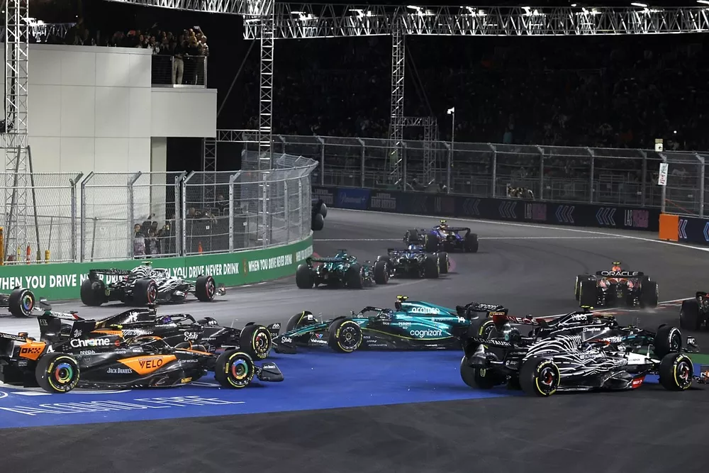 Logan Sargeant, Williams FW45, Esteban Ocon, Alpine A523, Lance Stroll, Aston Martin AMR23, Sergio Perez, Red Bull Racing RB19, as Fernando Alonso, Aston Martin AMR23, spins at the start