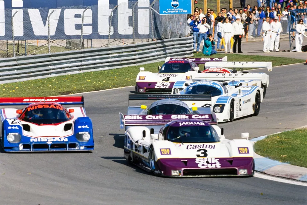 Martin Brundle / Jan Lammers / Tom Walkinshaw Racing, Jaguar XJR-11, leads Mark Blundell / Julian Bailey, Nissan R90CK, Jonathan Palmer / Hans-Joachim Stuck, Joest Racing, Porsche 962C, Bob Wollek / Frank Jelinski, Joest Racing, Porsche 962C, and Andy Wallace / Davy Jones, Tom Walkinshaw Racing, Jaguar XJR-11.