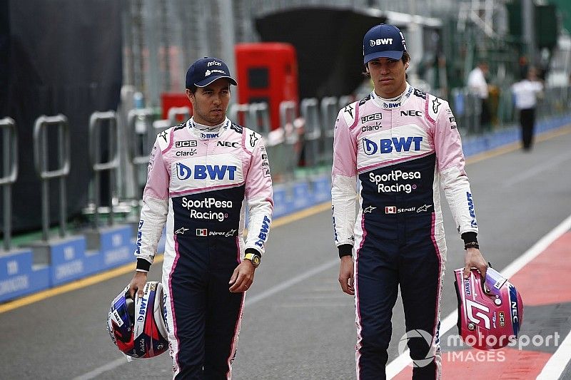 Sergio Perez, Racing Point, and Lance Stroll, Racing Point, in the pits