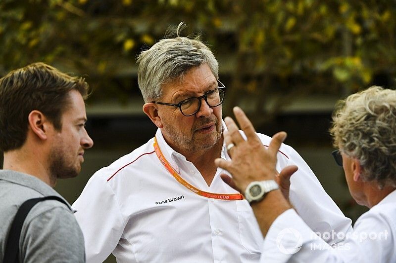 Dr Carsten Tilke, Ross Brawn, Managing Director of Motorsports, FOM and Hermann Tilke in the paddock.