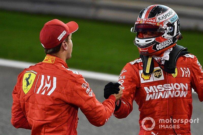 Sebastian Vettel, Ferrari, and Charles Leclerc, Ferrari, congratulate each other on locking out the front row