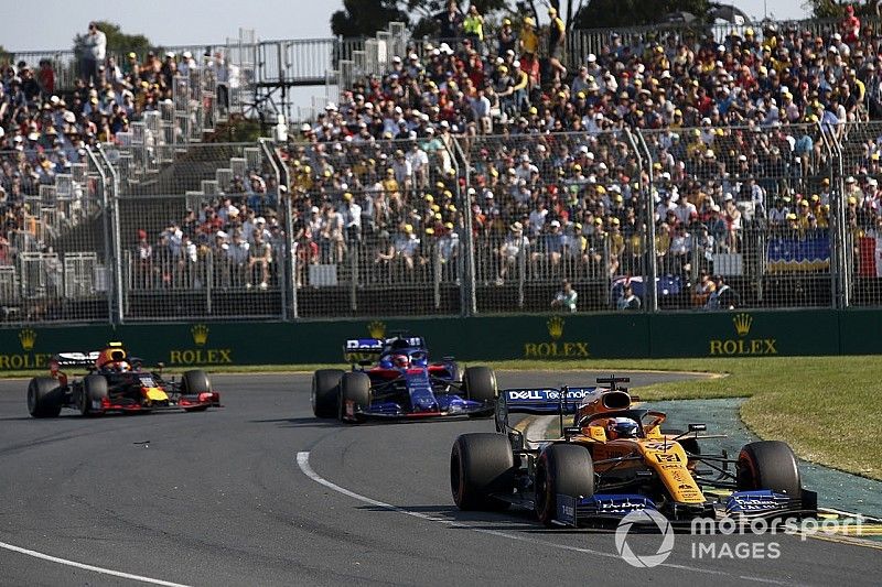 Carlos Sainz Jr., McLaren MCL34, leads Daniil Kvyat, Toro Rosso STR14, and Pierre Gasly, Red Bull Racing RB15