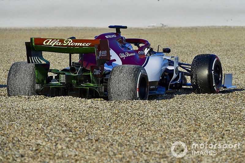 Kimi Raikkonen, Alfa Romeo Racing C38, spins into the gravel on the opening morning of testing