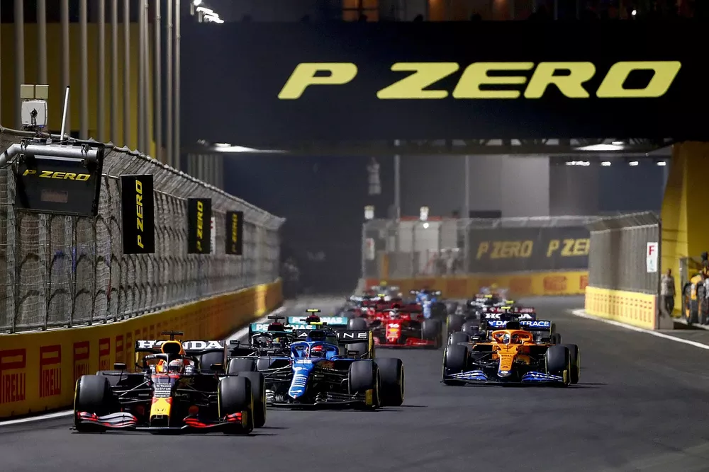 Max Verstappen, Red Bull Racing RB16B, Esteban Ocon, Alpine A521, and Lewis Hamilton, Mercedes W12