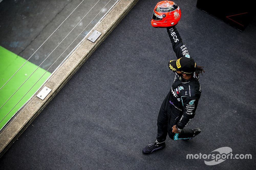 Lewis Hamilton, Mercedes-AMG Petronas F1, 1st position, on the podium with the helmet of Michael Schumacher
