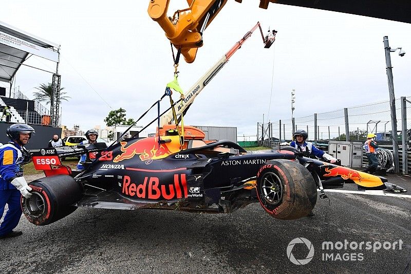 Marshals remove the car of Alexander Albon, Red Bull RB15, with a JCB