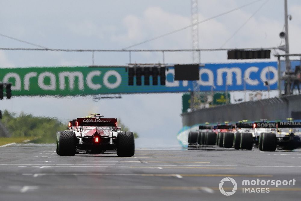 The drivers wait for the lights at the start