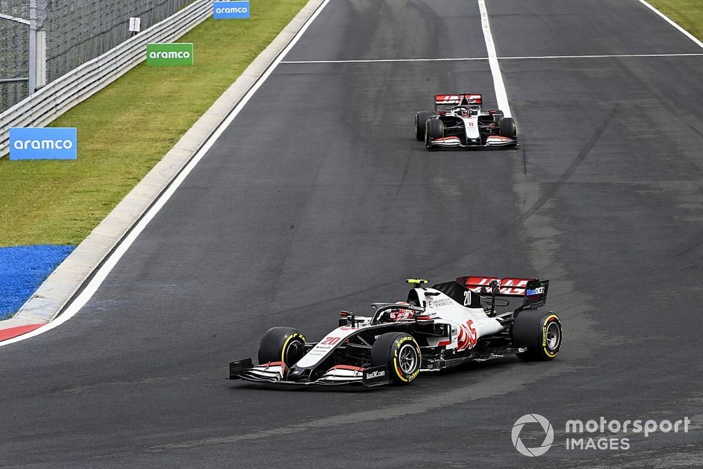 Kevin Magnussen, Haas VF-20, leads Romain Grosjean, Haas VF-20