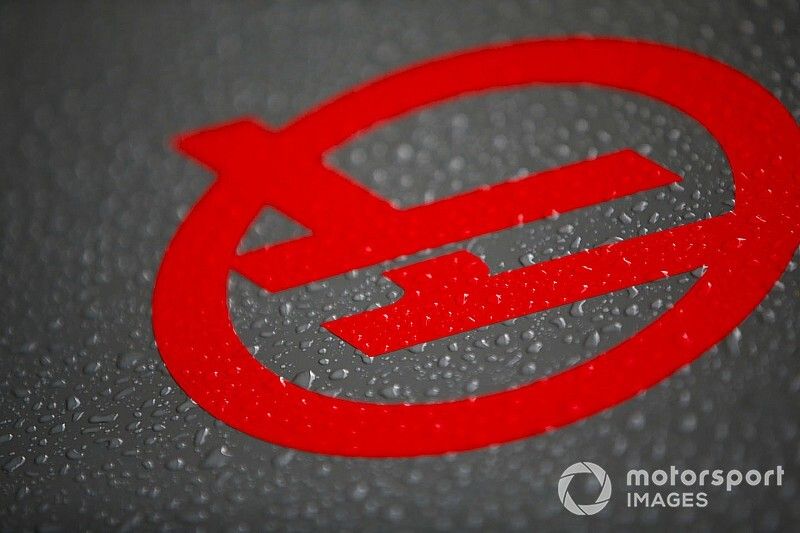 Haas F1 logo with rain water