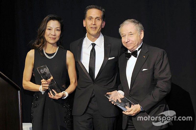 FIA President Jean Todt and his wife Michelle Yeoh accept the Humanitarian of the Year Award from th