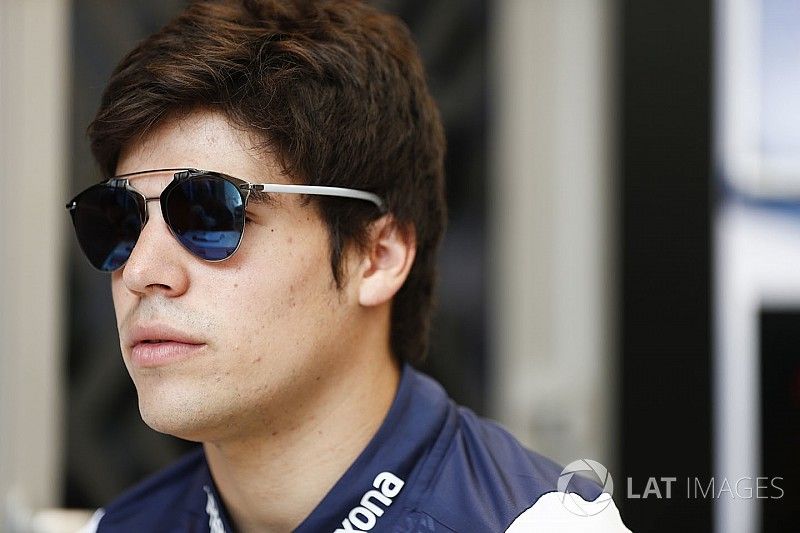 Lance Stroll, Williams Racing, talks to the press