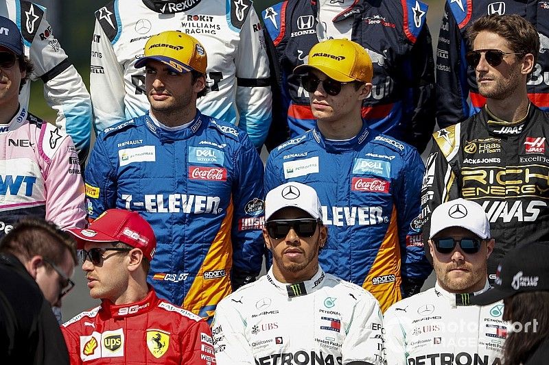 Carlos Sainz Jr., McLaren, Lando Norris, McLaren, and Romain Grosjean, Haas F1 stand behind Sebastian Vettel, Ferrari, Lewis Hamilton, Mercedes AMG F1, and Valtteri Bottas, Mercedes AMG F1