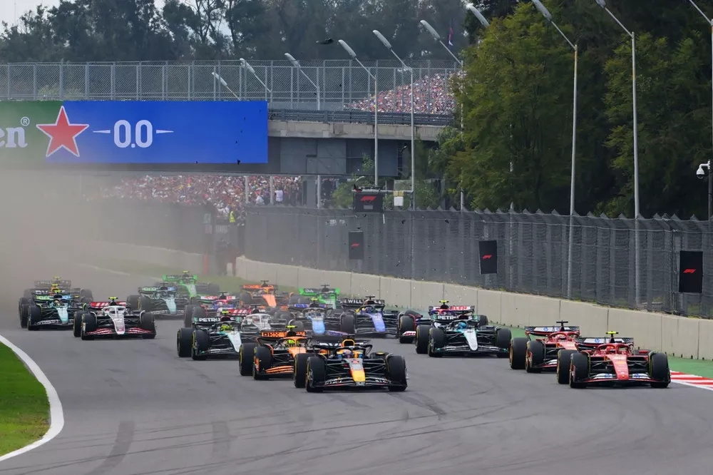 Race start, as Max Verstappen, Red Bull Racing RB20, battles with Carlos Sainz, Ferrari SF-24, for the lead