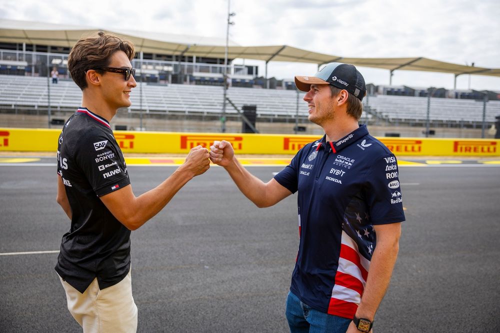George Russell, Mercedes-AMG F1 Team, and Max Verstappen, Red Bull Racing, chat on the Pirelli hot laps grid