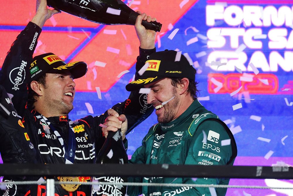 Sergio Perez, Red Bull Racing, 1st position, Fernando Alonso, Aston Martin F1 Team, provisionally 3rd position, celebrate on the podium