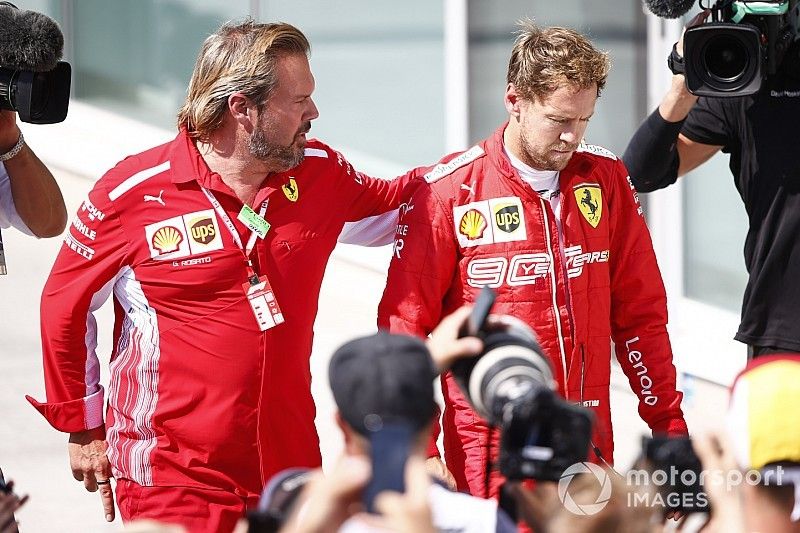 An upset Sebastian Vettel, Ferrari, 2nd position, returns for the podium ceremony