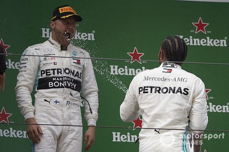 Valtteri Bottas, Mercedes AMG F1, 2nd position, is sprayed by Lewis Hamilton, Mercedes AMG F1, 1st position, with Champagne