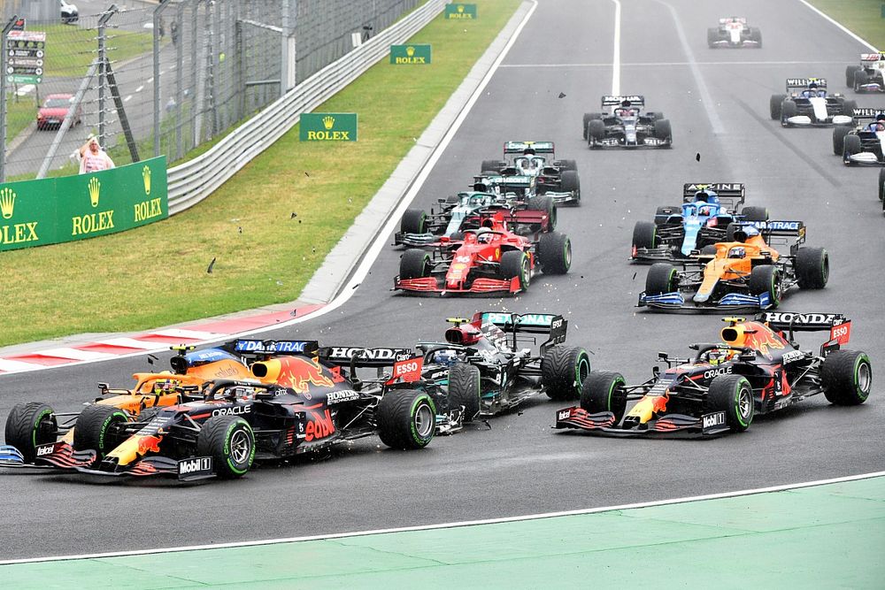 Valtteri Bottas, Mercedes W12, collides with Lando Norris, McLaren MCL35M, and Max Verstappen, Red Bull Racing RB16B, at the start