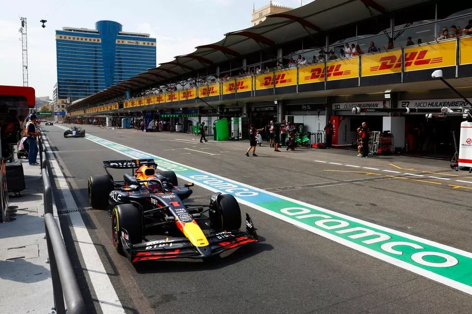 Max Verstappen, Red Bull Racing RB20, in the pit lane