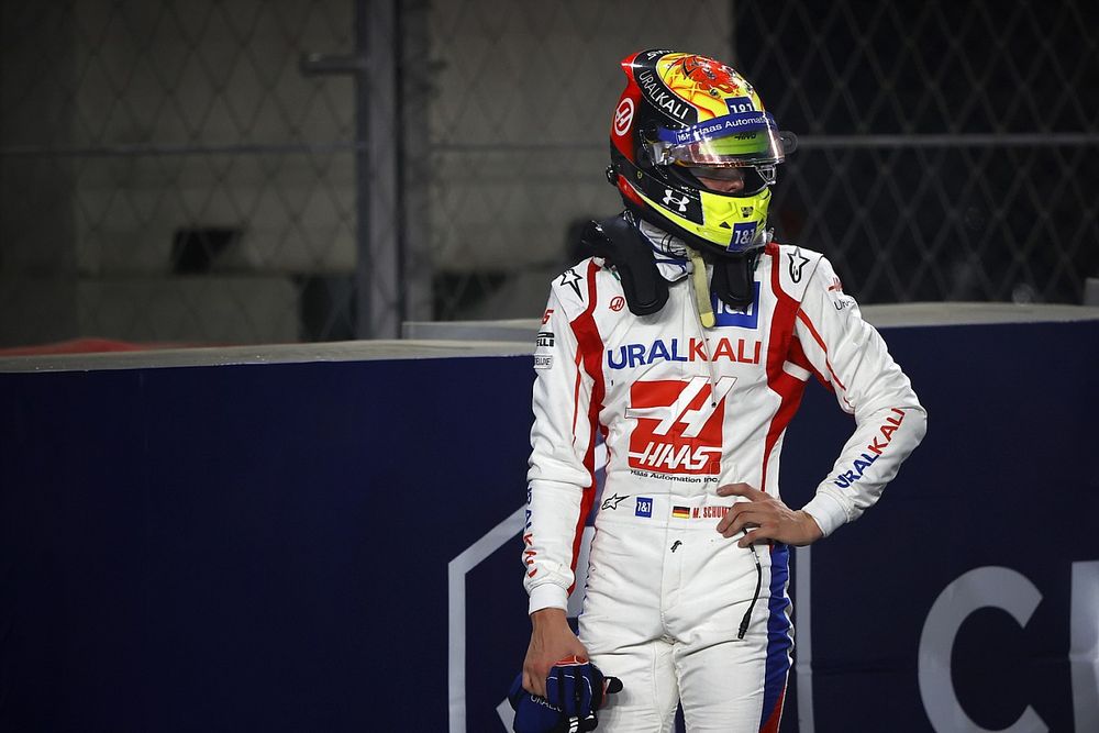 Mick Schumacher, Haas VF-21, climbs out of his car after crashing out of the race